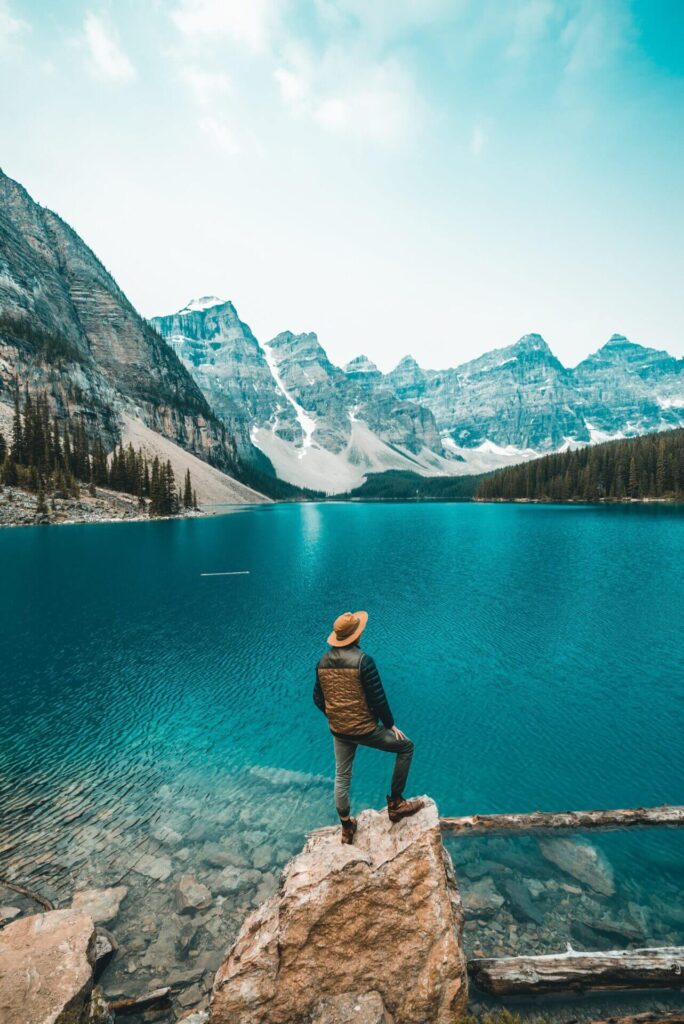 Wellness Journey - man looks out over beautiful blue lake