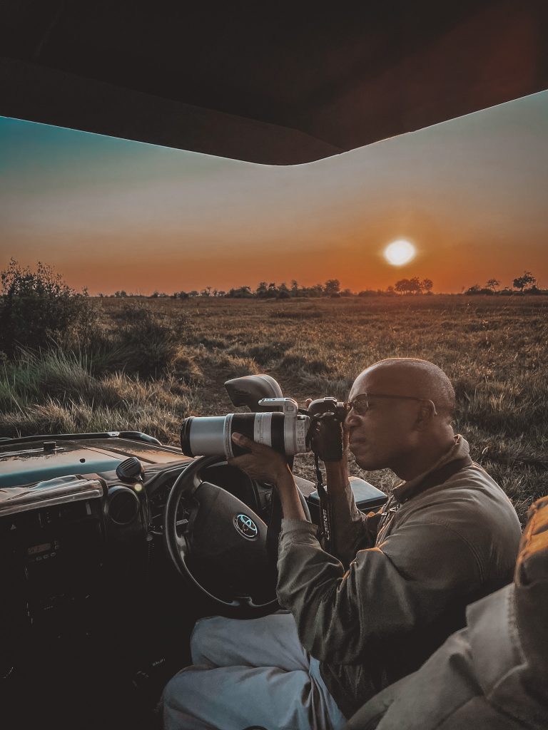 Our guide capturing some hyena at sunrise