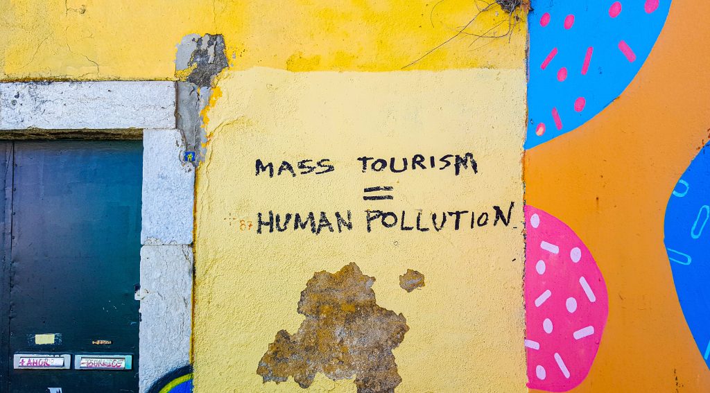Mass tourism equals mass pollution street art