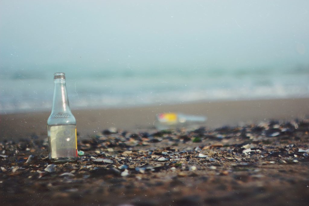 A beer bottle on the beach